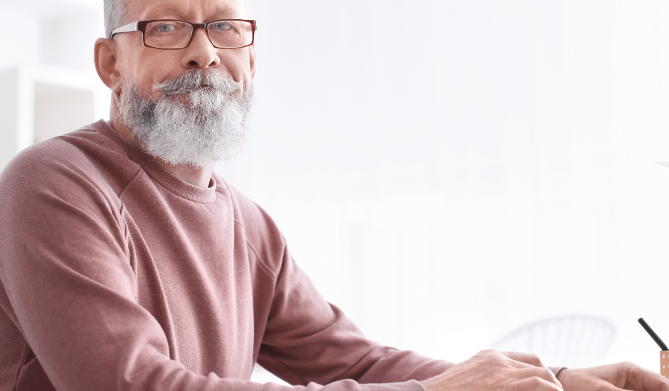 Elderly Unemployment: An older man working on laptop